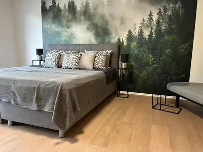 Ein Bett oder Betten in einem Zimmer der Unterkunft Ferienwohnung Weiss
