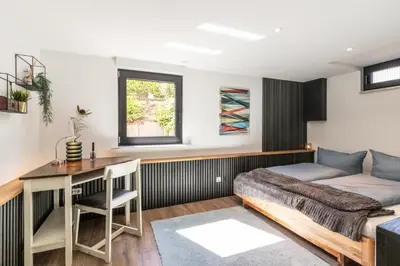 Ein Bett oder Betten in einem Zimmer der Unterkunft Eifelbergversteck Große und moderne Einliegerwohnung in Mayen