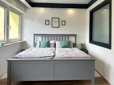 Ein Bett oder Betten in einem Zimmer der Unterkunft Ferienwohnung an der Eisdiele