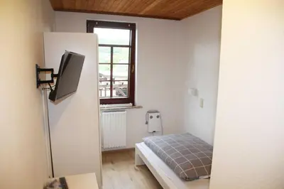Ein Bett oder Betten in einem Zimmer der Unterkunft Hotel Zur Krone
