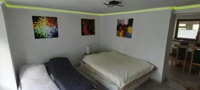 Ein Bett oder Betten in einem Zimmer der Unterkunft Ferienwohnung Trier-Euren