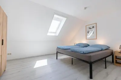 Ein Bett oder Betten in einem Zimmer der Unterkunft Pitlane-Apartment 2