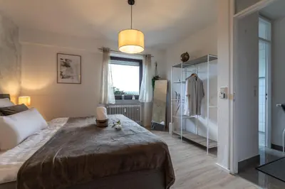 Ein Bett oder Betten in einem Zimmer der Unterkunft Cozy II Luxuriös Moselview Terrasse Garten NETFLIX