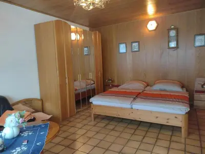 Ein Bett oder Betten in einem Zimmer der Unterkunft Ferienwohnung Huhn