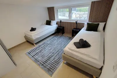 Ein Bett oder Betten in einem Zimmer der Unterkunft Apprimus Ferienwohnungen - Waldsee Rieden