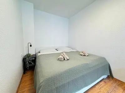 Ein Bett oder Betten in einem Zimmer der Unterkunft Großes Apartment an der Loreley
