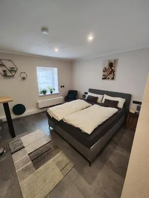 Ein Bett oder Betten in einem Zimmer der Unterkunft Ferienzimmer Geyersberg
