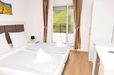 Ein Bett oder Betten in einem Zimmer der Unterkunft Hotel Briedeler Haus