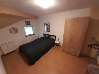 Ein Bett oder Betten in einem Zimmer der Unterkunft Ferienwohnung 