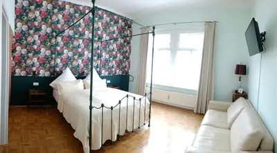 Ein Bett oder Betten in einem Zimmer der Unterkunft Ferienhaus Historischer Winzerverein Boutique B&B