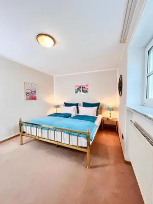 Ein Bett oder Betten in einem Zimmer der Unterkunft Ferienhaus Daddy Bernd