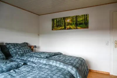 Ein Bett oder Betten in einem Zimmer der Unterkunft Ferienwohnung Boxenstopp