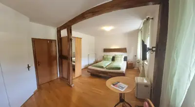 Ein Bett oder Betten in einem Zimmer der Unterkunft Gasthaus Korneli