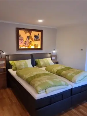 Ein Bett oder Betten in einem Zimmer der Unterkunft Gasthaus Korneli