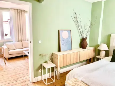 Ein Bett oder Betten in einem Zimmer der Unterkunft Historisches Apartment II MINIMALUS