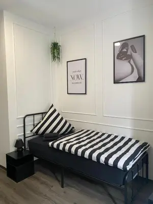 Ein Bett oder Betten in einem Zimmer der Unterkunft Appartements am Alten Löhrtor