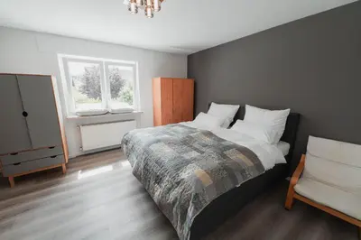 Ein Bett oder Betten in einem Zimmer der Unterkunft Julia's Mosel Villa Appartement TONY