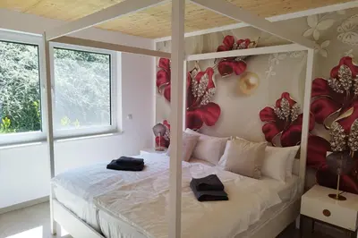 Ein Bett oder Betten in einem Zimmer der Unterkunft Apprimus Ferienwohnungen - Waldsee Rieden Panoramaterrasse 2 EG