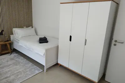 Ein Bett oder Betten in einem Zimmer der Unterkunft Apprimus Ferienwohnungen - Waldsee Rieden Panoramaterrasse 6 OG