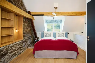 Ein Bett oder Betten in einem Zimmer der Unterkunft Winzerhof Ross & Rose