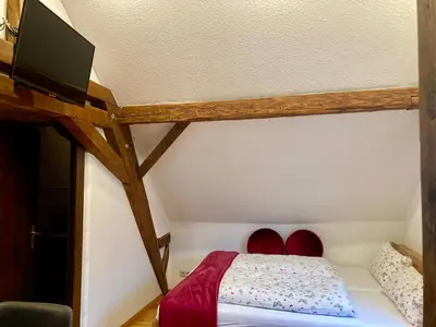 Ein Bett oder Betten in einem Zimmer der Unterkunft Turmstube