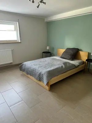 Ein Bett oder Betten in einem Zimmer der Unterkunft Ferienwohnung Morgenblüte