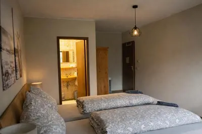 Ein Bett oder Betten in einem Zimmer der Unterkunft Pension zur Quelle