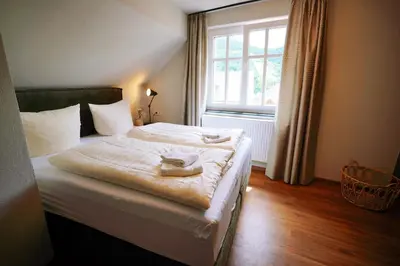 Ein Bett oder Betten in einem Zimmer der Unterkunft Winzerhaus am Kardinalsberg