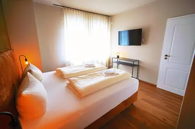 Ein Bett oder Betten in einem Zimmer der Unterkunft Winzerhaus am Kardinalsberg