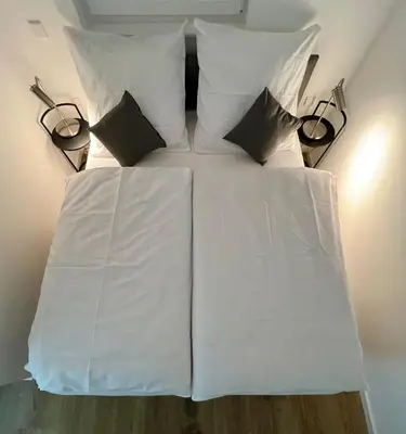Ein Bett oder Betten in einem Zimmer der Unterkunft FeWo Riesling