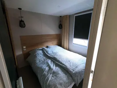 Ein Bett oder Betten in einem Zimmer der Unterkunft Mobilheim Ohara