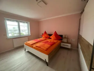 Ein Bett oder Betten in einem Zimmer der Unterkunft Ferienwohnung Hochwaldblick 5