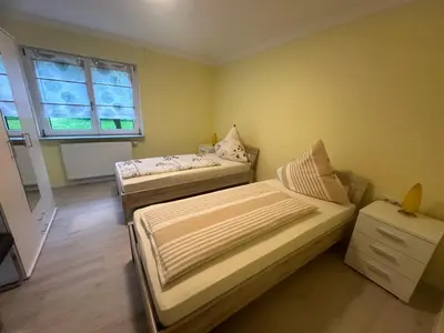 Ein Bett oder Betten in einem Zimmer der Unterkunft Ferienwohnung Hochwaldblick 5