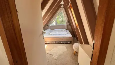 Ein Bett oder Betten in einem Zimmer der Unterkunft Gemütliches Ferienhaus in der Eifel mit Pool, Tennisplatz, Minigolf und nahem See