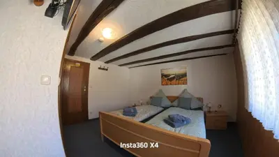 Ein Bett oder Betten in einem Zimmer der Unterkunft Gästehaus Eulenköpfchen