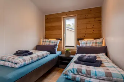 Ein Bett oder Betten in einem Zimmer der Unterkunft Chalet Seeblick I Terrasse I Aussicht I Wandern