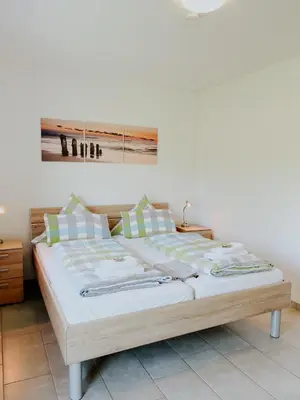 Ein Bett oder Betten in einem Zimmer der Unterkunft Haus Ehrenbreitstein