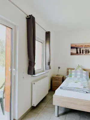 Ein Bett oder Betten in einem Zimmer der Unterkunft Haus Ehrenbreitstein