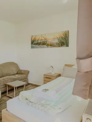 Ein Bett oder Betten in einem Zimmer der Unterkunft Haus Marksburg