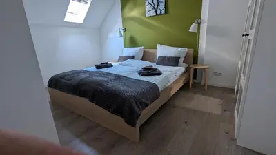 Ein Bett oder Betten in einem Zimmer der Unterkunft Rheinsteig-Ferienwohnungen 5 Apartments