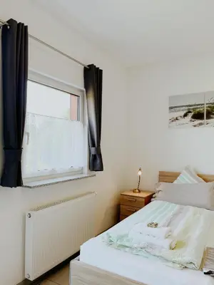 Ein Bett oder Betten in einem Zimmer der Unterkunft Haus Rheinblick