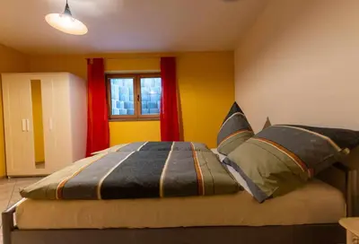 Ein Bett oder Betten in einem Zimmer der Unterkunft Fernan's Ferienwohnung