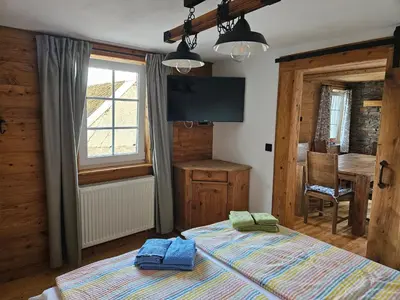 Ein Bett oder Betten in einem Zimmer der Unterkunft Hofis Gästehaus