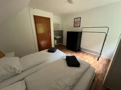 Ein Bett oder Betten in einem Zimmer der Unterkunft Ruhiges Ferienhaus in Burgnähe
