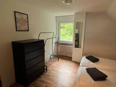 Ein Bett oder Betten in einem Zimmer der Unterkunft Ruhiges Ferienhaus in Burgnähe