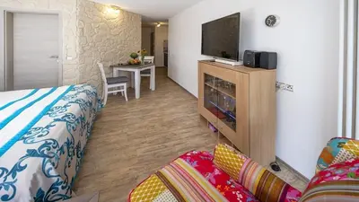 Ein Bett oder Betten in einem Zimmer der Unterkunft Ferienwohnung Studio Vulkanhöhe - im Maarberg Resort - in Schalkenmehren am See