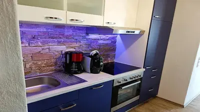 Küche/Küchenzeile in der Unterkunft Ferienwohnung Studio Vulkanhöhe - im Maarberg Resort - in Schalkenmehren am See
