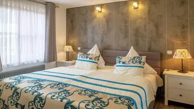 Ein Bett oder Betten in einem Zimmer der Unterkunft Ferienwohnung Apartment Seeidyll - im Maarberg Resort - in Schalkenmehren am See