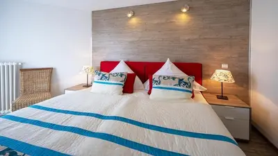 Ein Bett oder Betten in einem Zimmer der Unterkunft Ferienwohnung Maaridyll - im Maarberg Resort - in Schalkenmehren am See