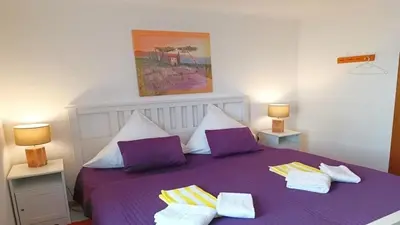 Ein Bett oder Betten in einem Zimmer der Unterkunft Ferienwohnung Seeblick II